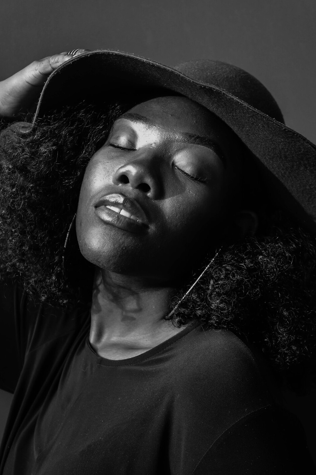 Studio portrait of a Black woman smiling warmly